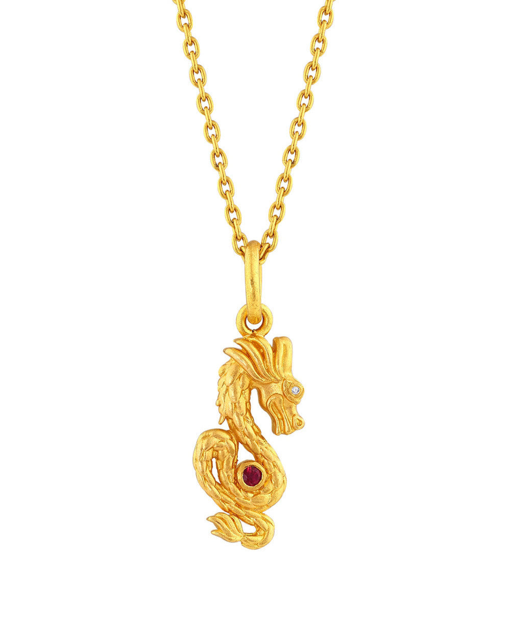 A small gold dragon pendant with a central bezel set ruby and two tiny diamonds in the eyes, on a separate chain.