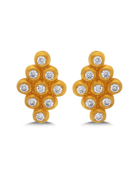 Gold earrings with diamond-like stones on a white background