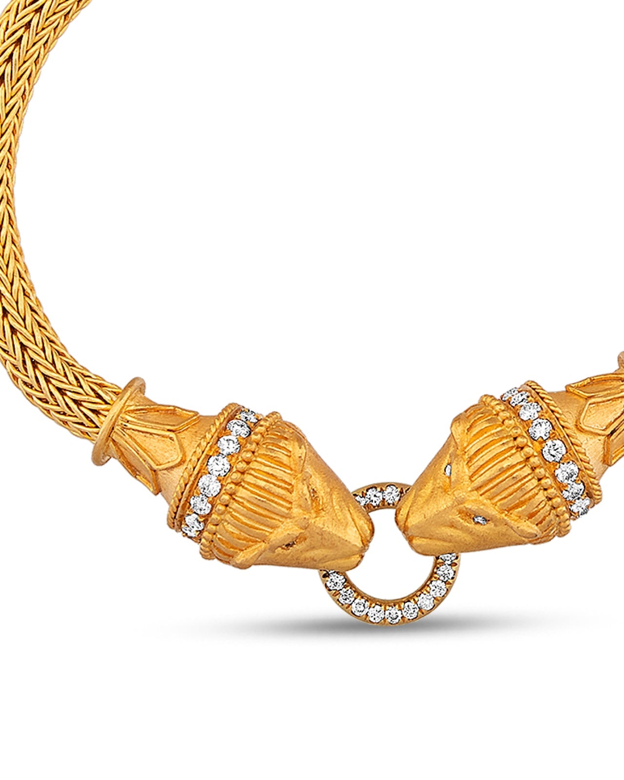 Gold necklace with intricate design and diamond accents on a white background