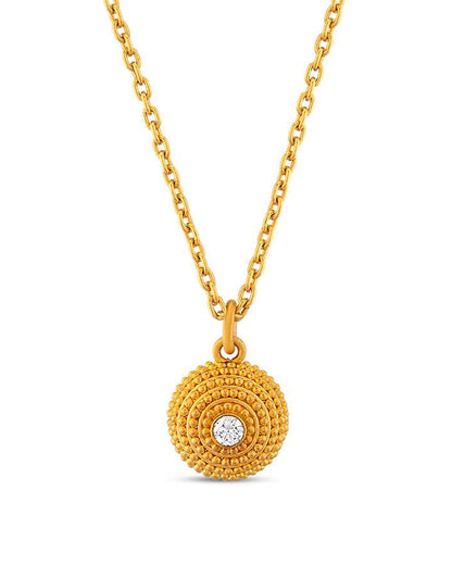 A gold dome pendant with granulated details and a central diamond, against a white background.