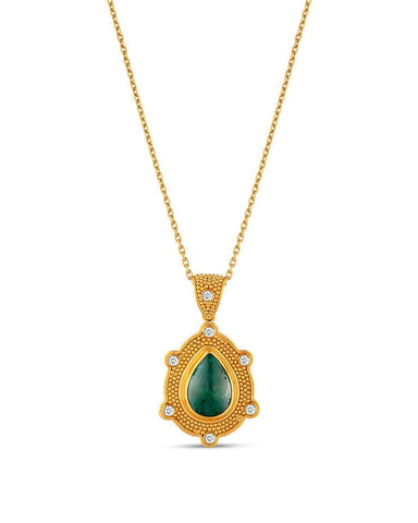 A gold pendant featuring a central emerald gemstone with smaller diamonds around it, on a chain that is not included.