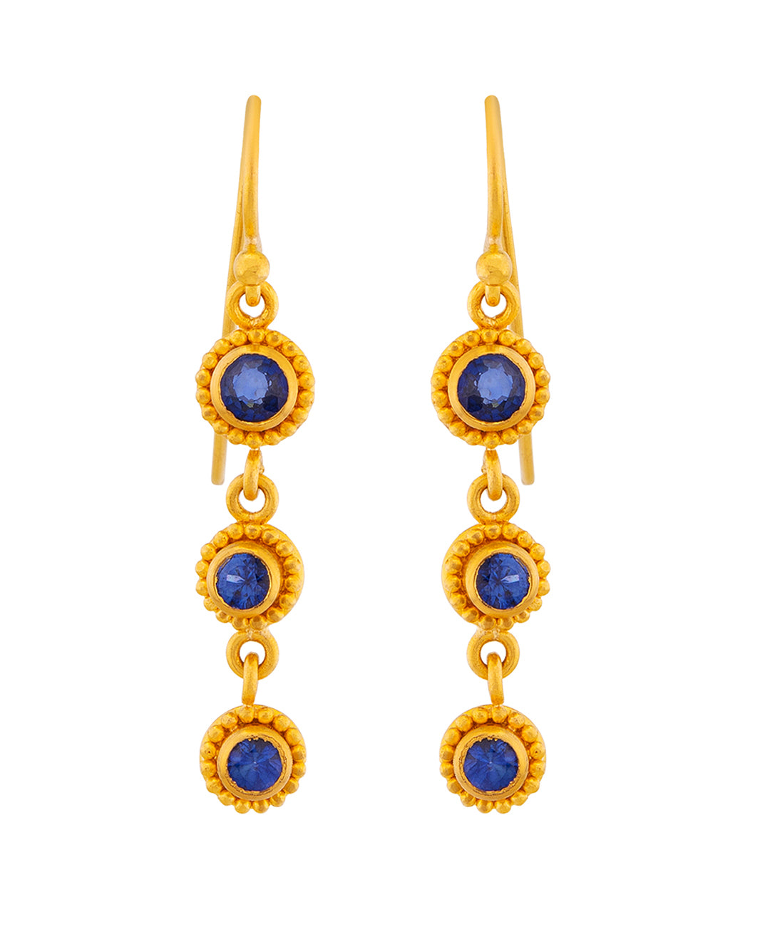 Gold earrings with blue gemstones on a white background